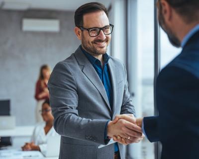 businessman shaking hands with client