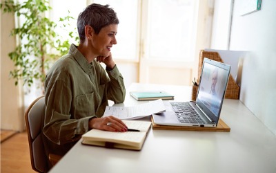 woman learning online at laptop